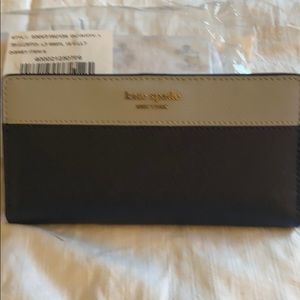 Kate spate large slim bifold wallet.